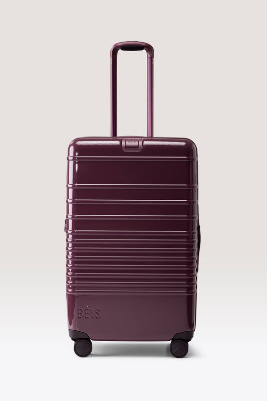 The Medium Check-In Roller in Glossy Plum
